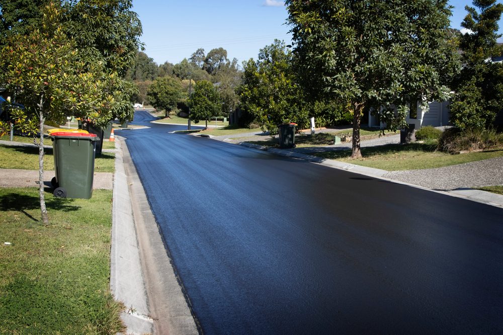 Suburban,road,resurfaced,with,fresh,asphalt.,construction,of,new,tar